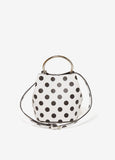 Polka dot faux leather bucket bag with silver-tone hardware, top handle and detachable adjustable shoulder strap.