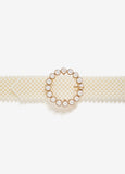 Waist belt with faux pearl embellishments and gold-tone hardware. Buckle fastening at front.