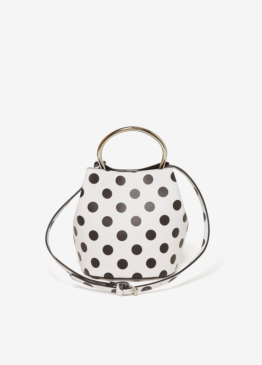 Polka dot faux leather bucket bag with silver-tone hardware, top handle and detachable adjustable shoulder strap.